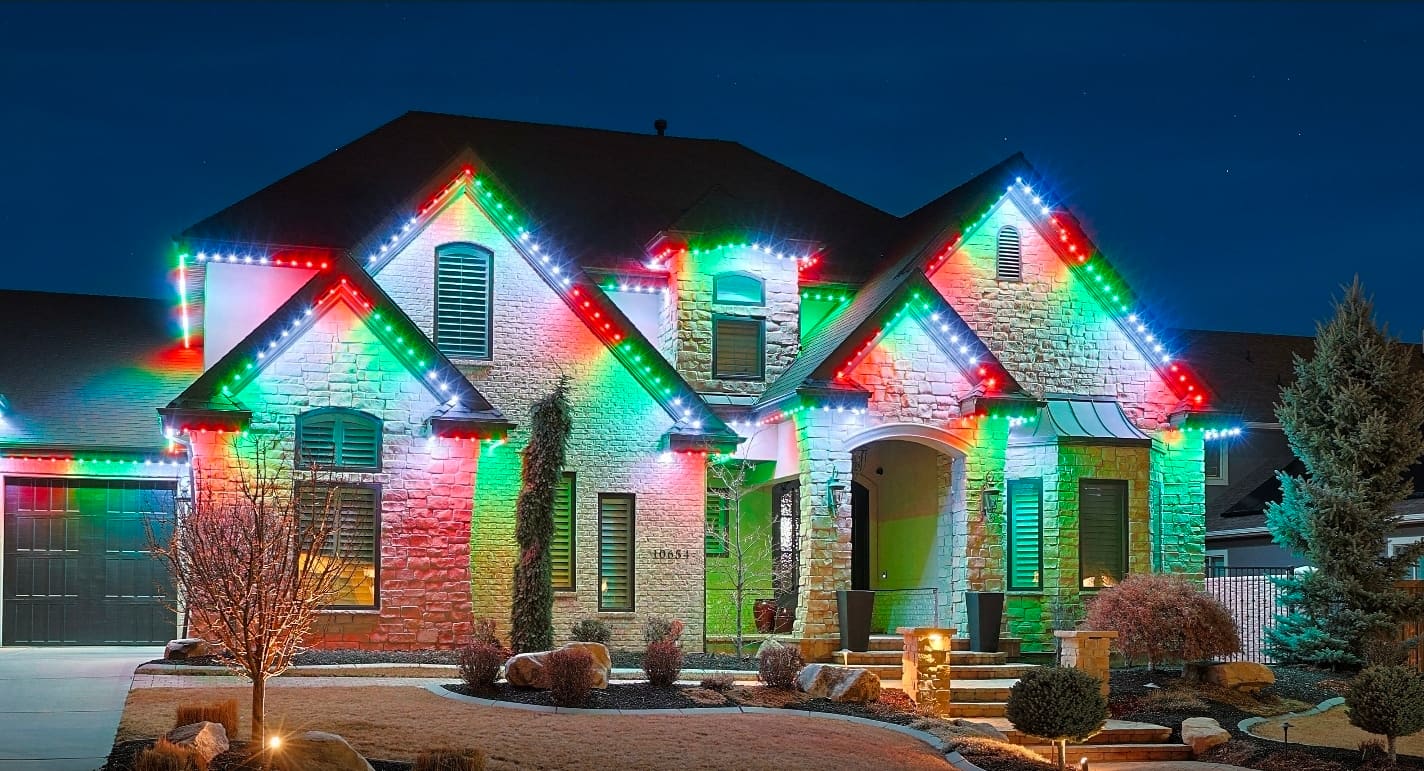 Permanent LED lights along home soffit and roofline creating warm holiday ambiance