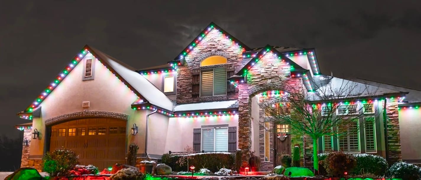 South Jersey home decorated with permanent Christmas holiday lighting in red and green