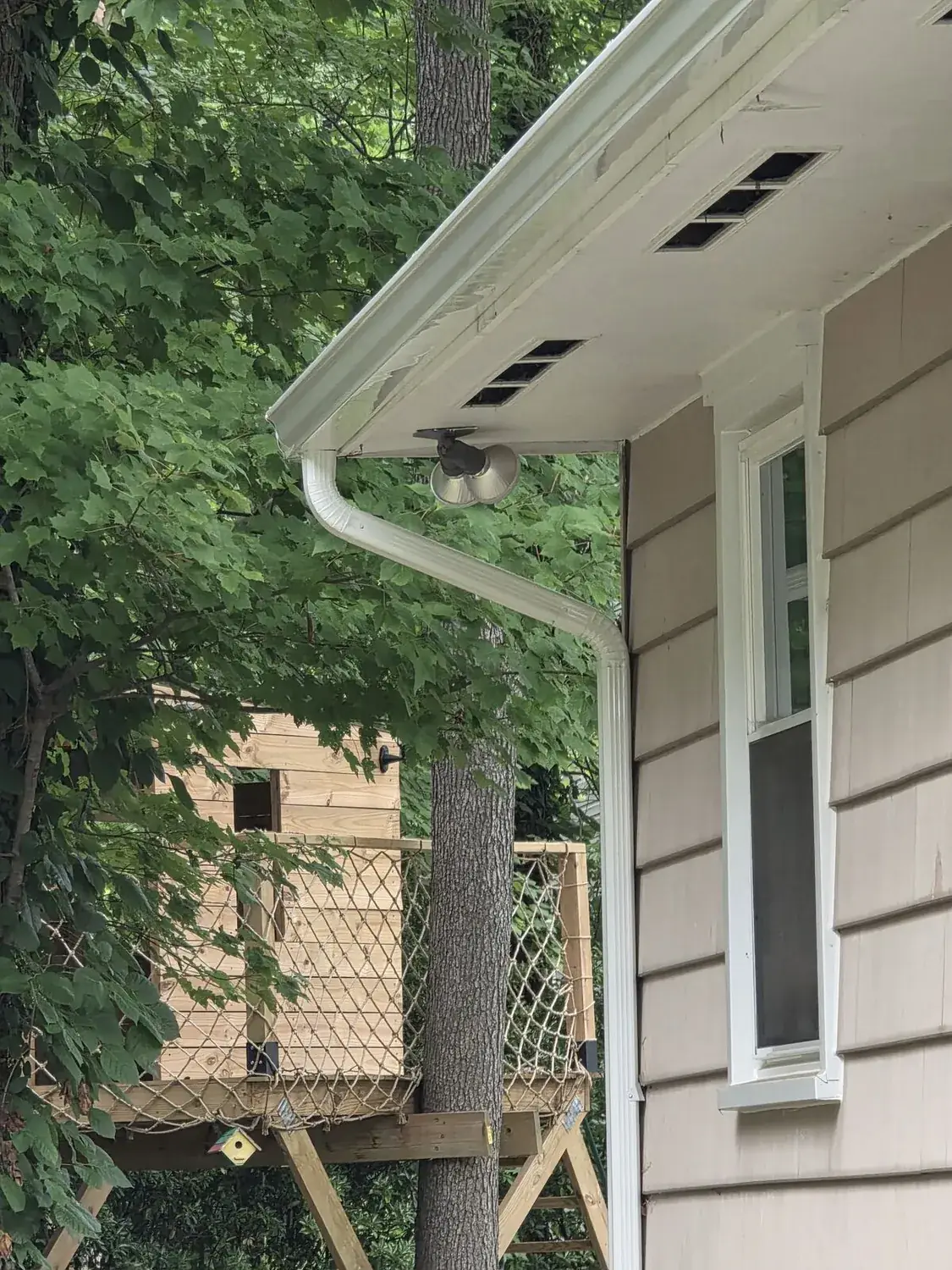 Close-up of professional seamless gutter craftsmanship