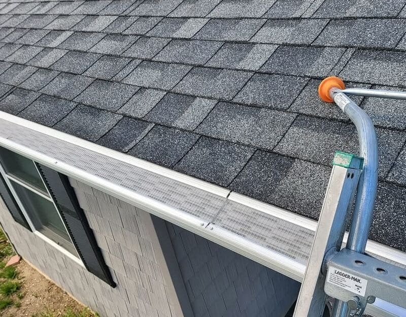 Micro-mesh gutter guard run installed along the gutter line on a customer home