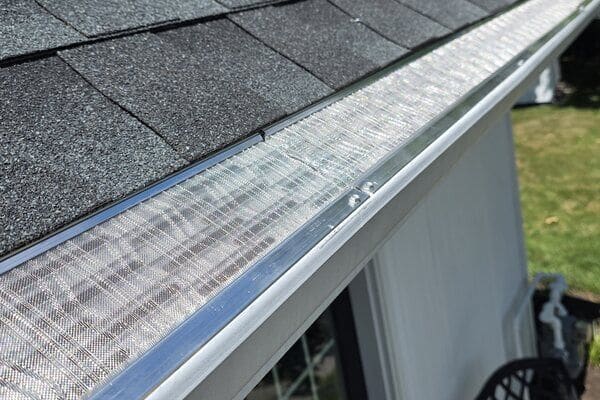 Close-up of LeafBlaster Pro micro-mesh gutter guard freshly installed on a South Jersey roofline