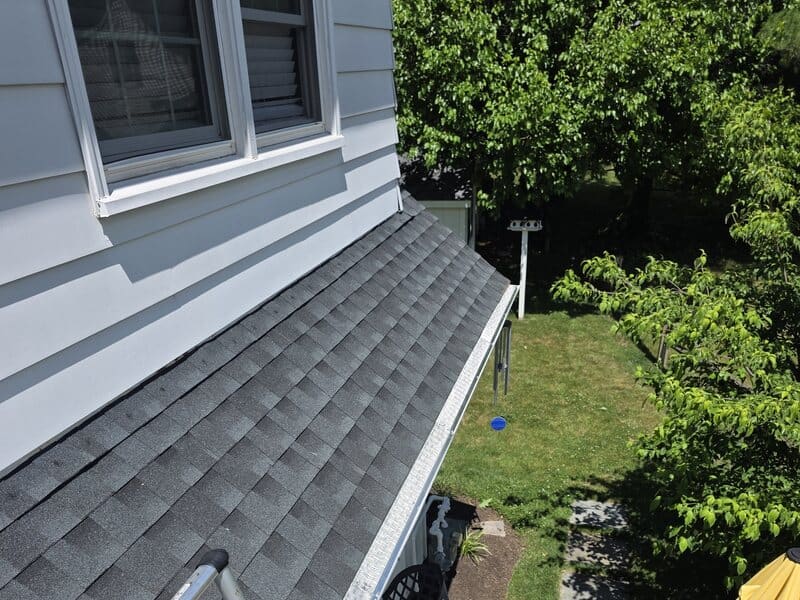 Close-up of LeafBlaster Pro micro-mesh gutter guard freshly installed on a customer roof